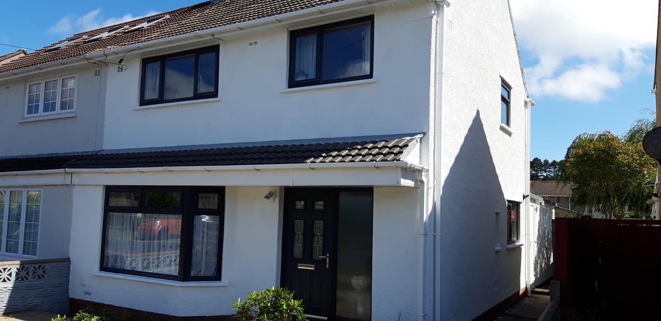 Home exterior with fresh white render by BBS Wales