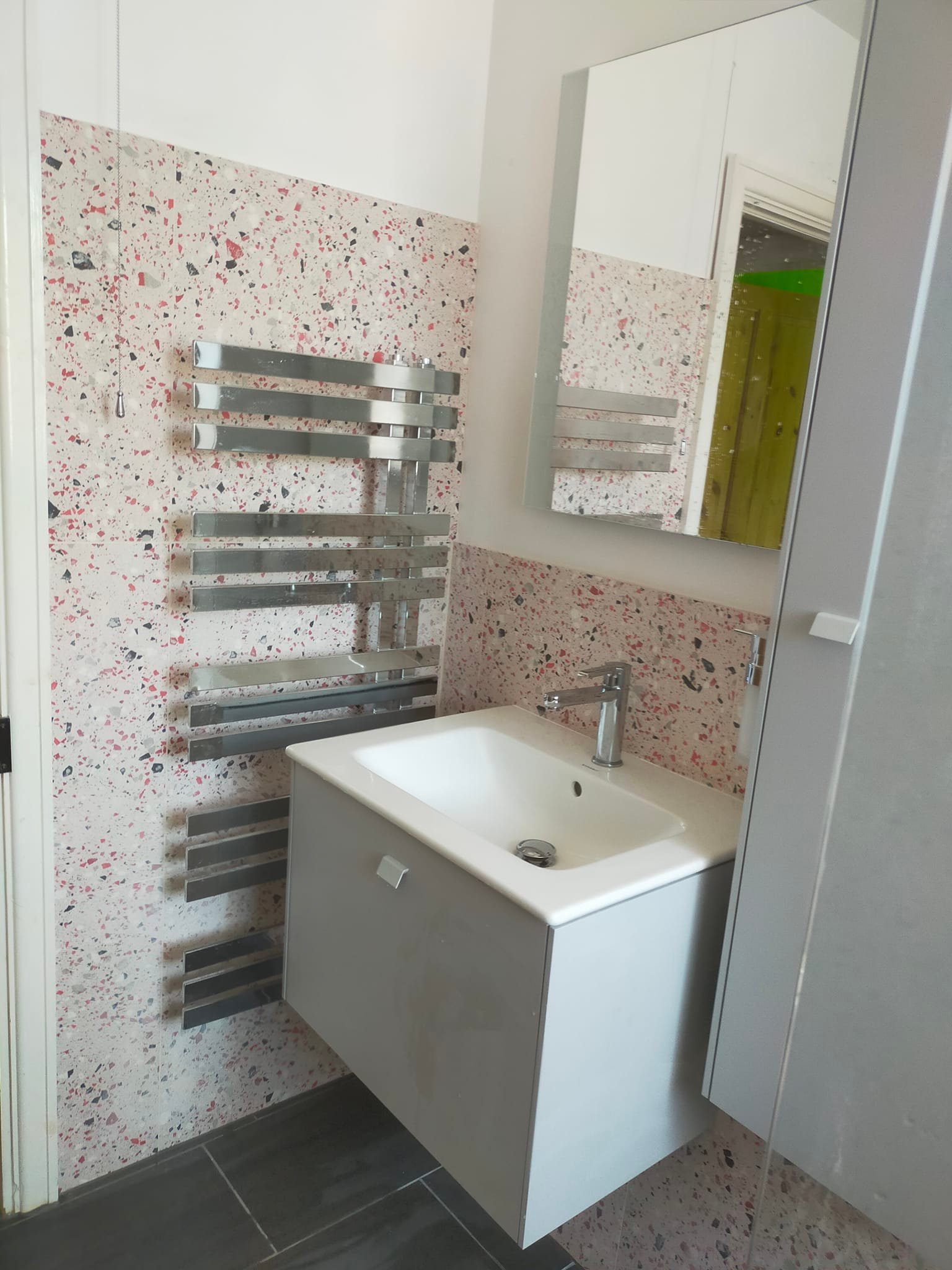 Bathroom makeover with terrazzo feature wall by BBS Wales